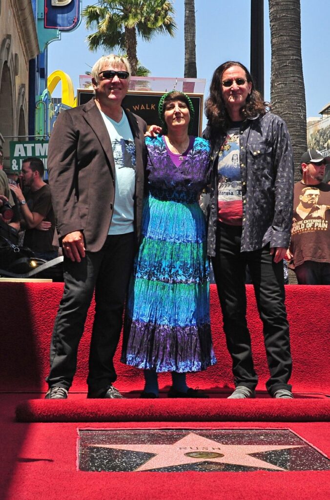 Donna Halper with Alex Lifeson and Geddy Lee at the Rush Hollywood Walk of Fame star ceremony, June 2010